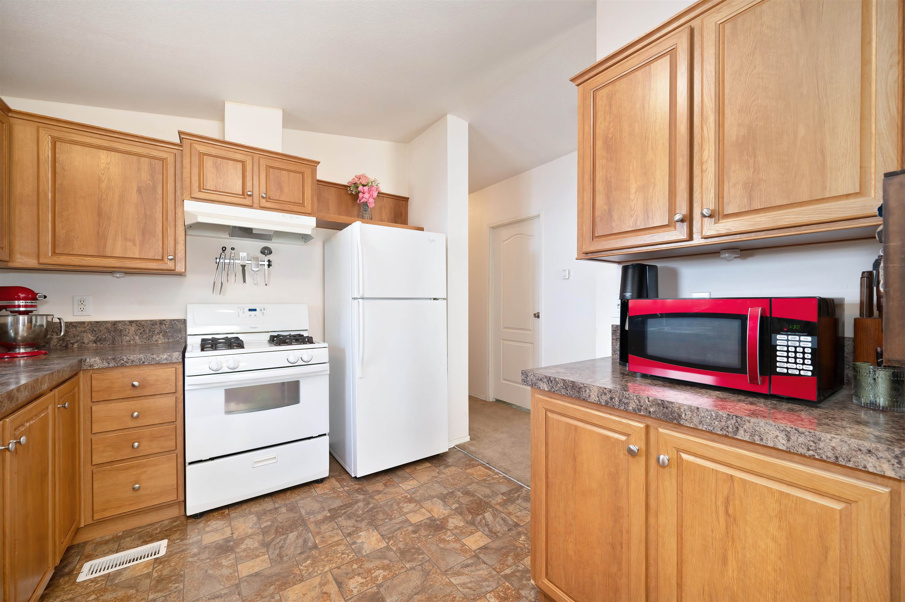 1080 Julie Lane, Unit 255 South Lake Tahoe, CA 96150 - Photo 13 of 26 a kitchen with stainless steel appliances granite countertop a refrigerator sink and cabinets