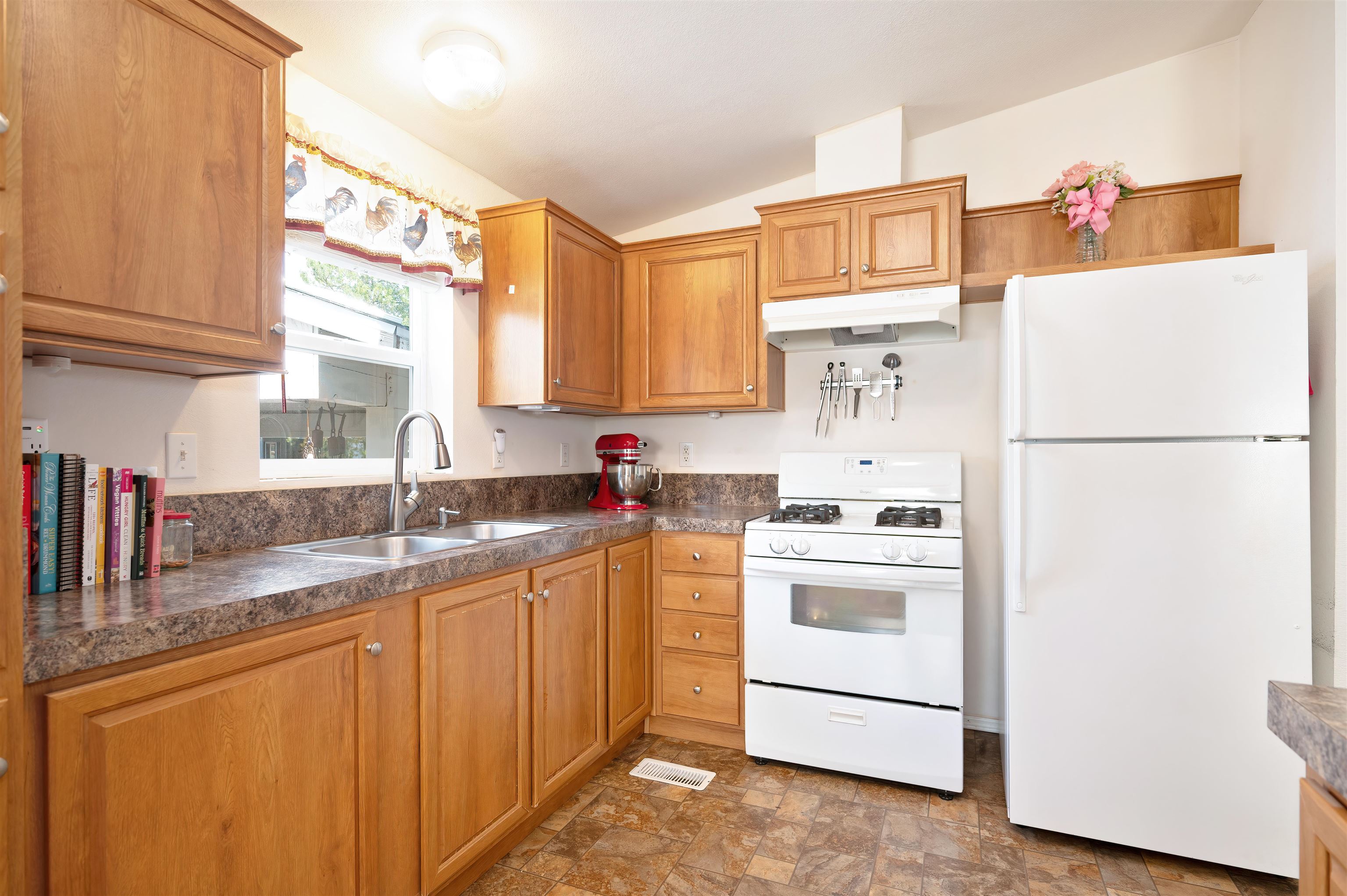 1080 Julie Lane, Unit 255 South Lake Tahoe, CA 96150 - Photo 14 of 26 a kitchen with a sink a refrigerator and a window