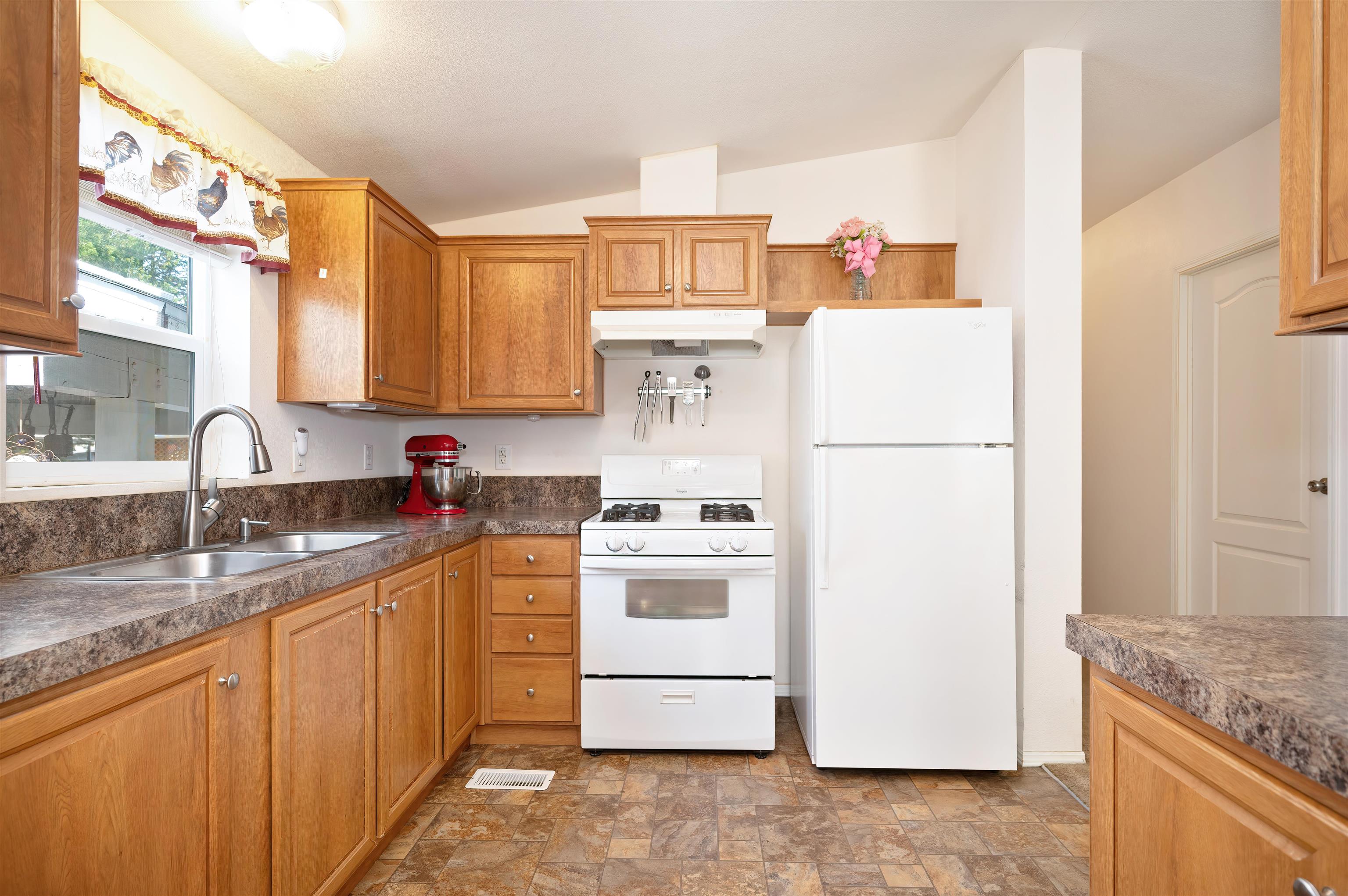 1080 Julie Lane, Unit 255 South Lake Tahoe, CA 96150 - Photo 15 of 26 a kitchen with a white stove top oven and refrigerator