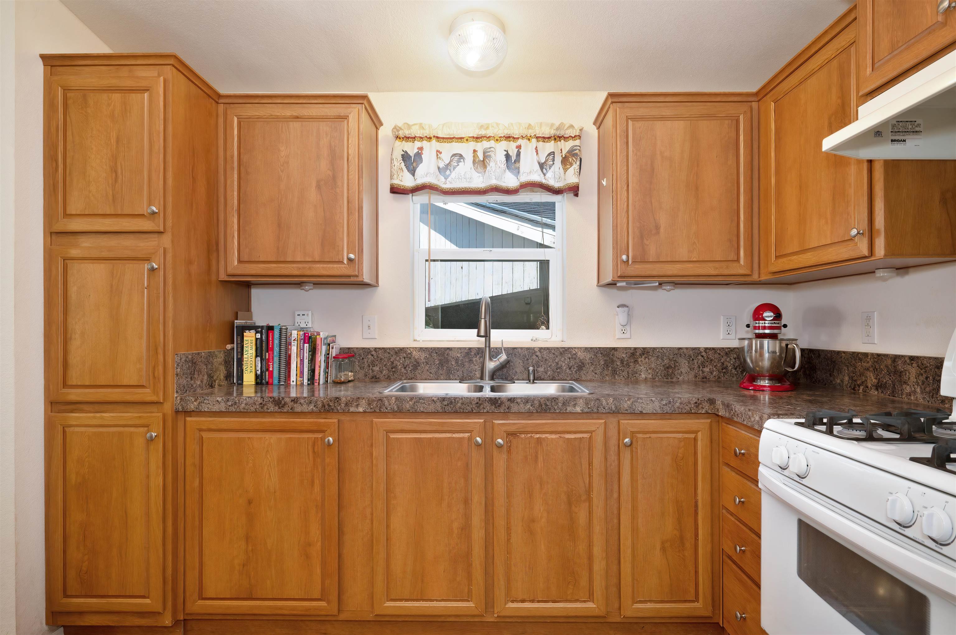 1080 Julie Lane, Unit 255 South Lake Tahoe, CA 96150 - Photo 16 of 26 a kitchen with kitchen island granite countertop a sink cabinets and stainless steel appliances