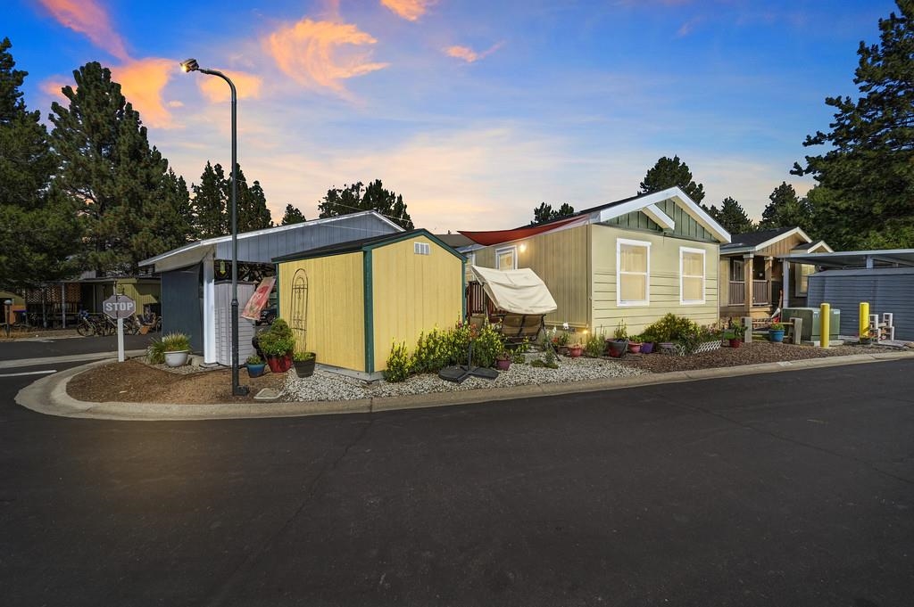 1080 Julie Lane, Unit 255 South Lake Tahoe, CA 96150 - Photo 2 of 26 a front view of a house with a garden and yard