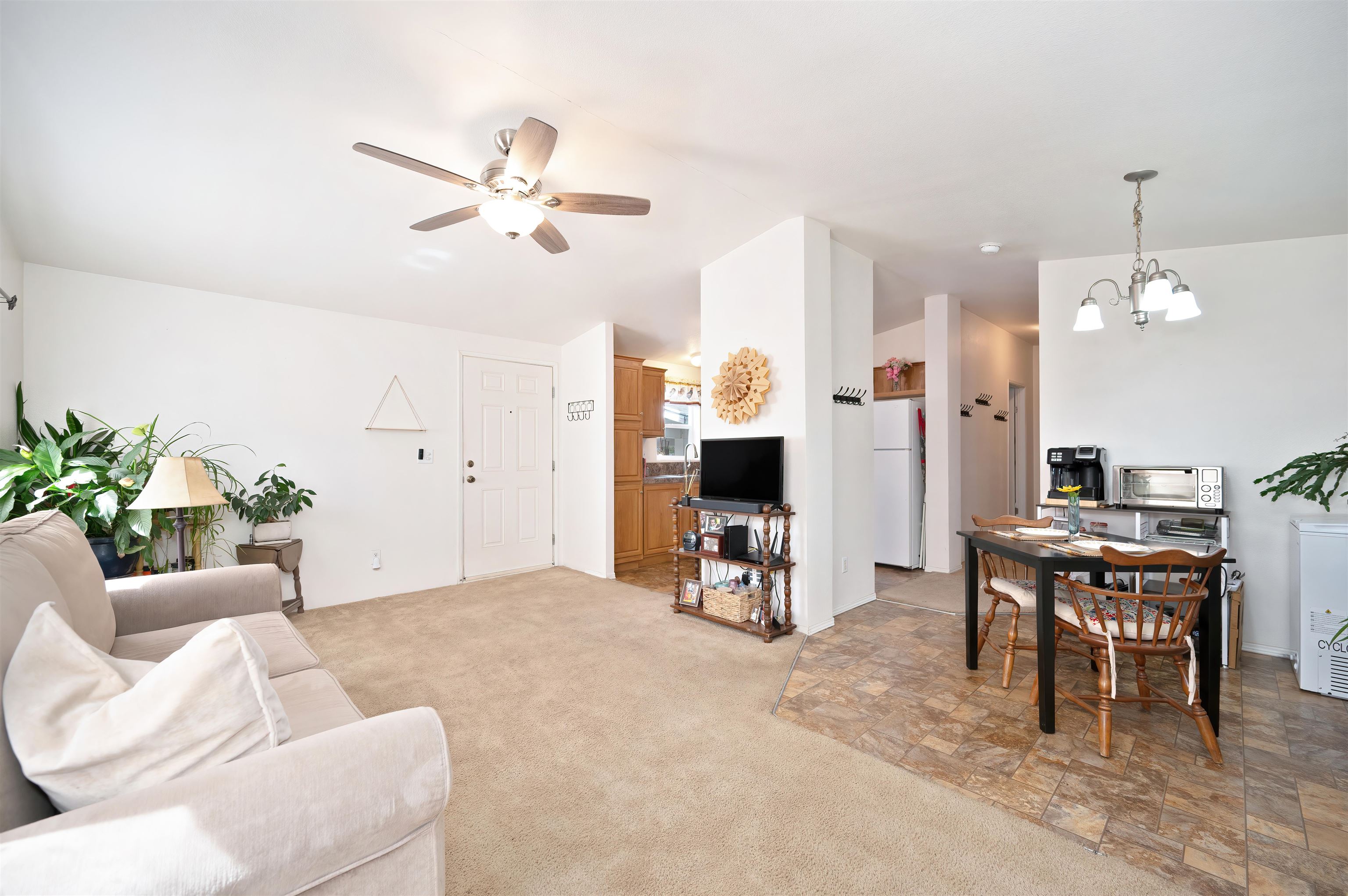 1080 Julie Lane, Unit 255 South Lake Tahoe, CA 96150 - Photo 8 of 26 a living room with furniture a dining table and a potted plant