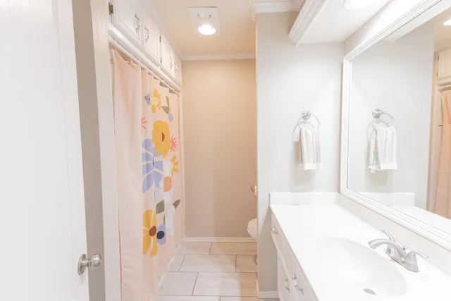 a bathroom with a tub sink and shower