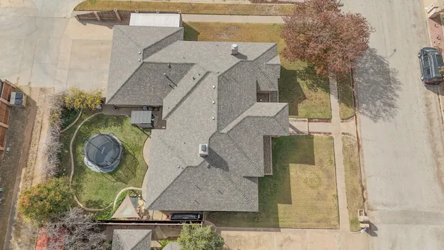 a view of a house with a yard and sitting space