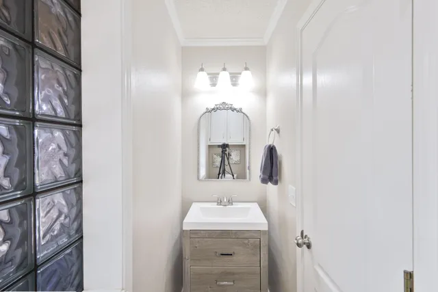 a bathroom with a sink and a mirror