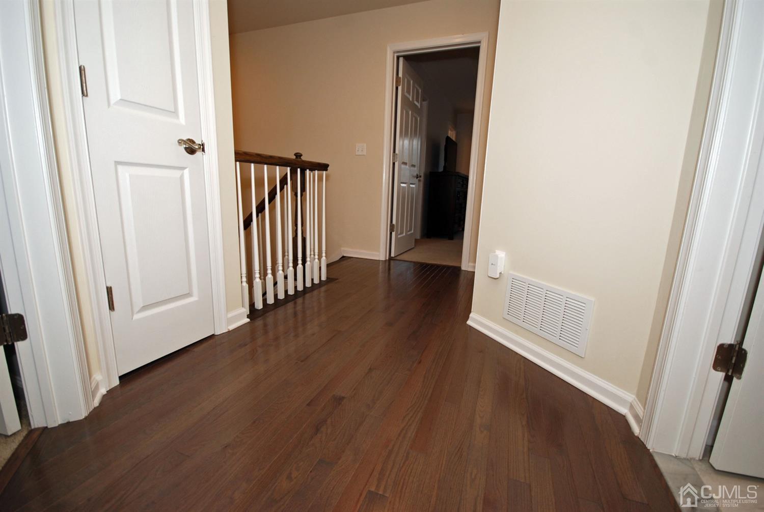 9 Flagger Lane Hamilton, NJ 08619 - Photo 12 of 24 a view of a hallway with wooden floor