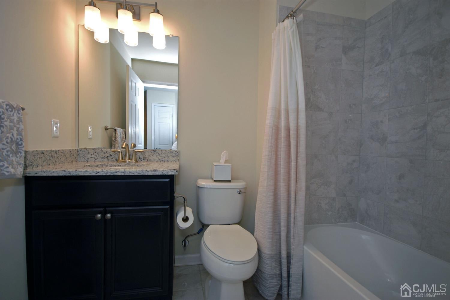 9 Flagger Lane Hamilton, NJ 08619 - Photo 20 of 24 a bathroom with a sink a toilet and shower