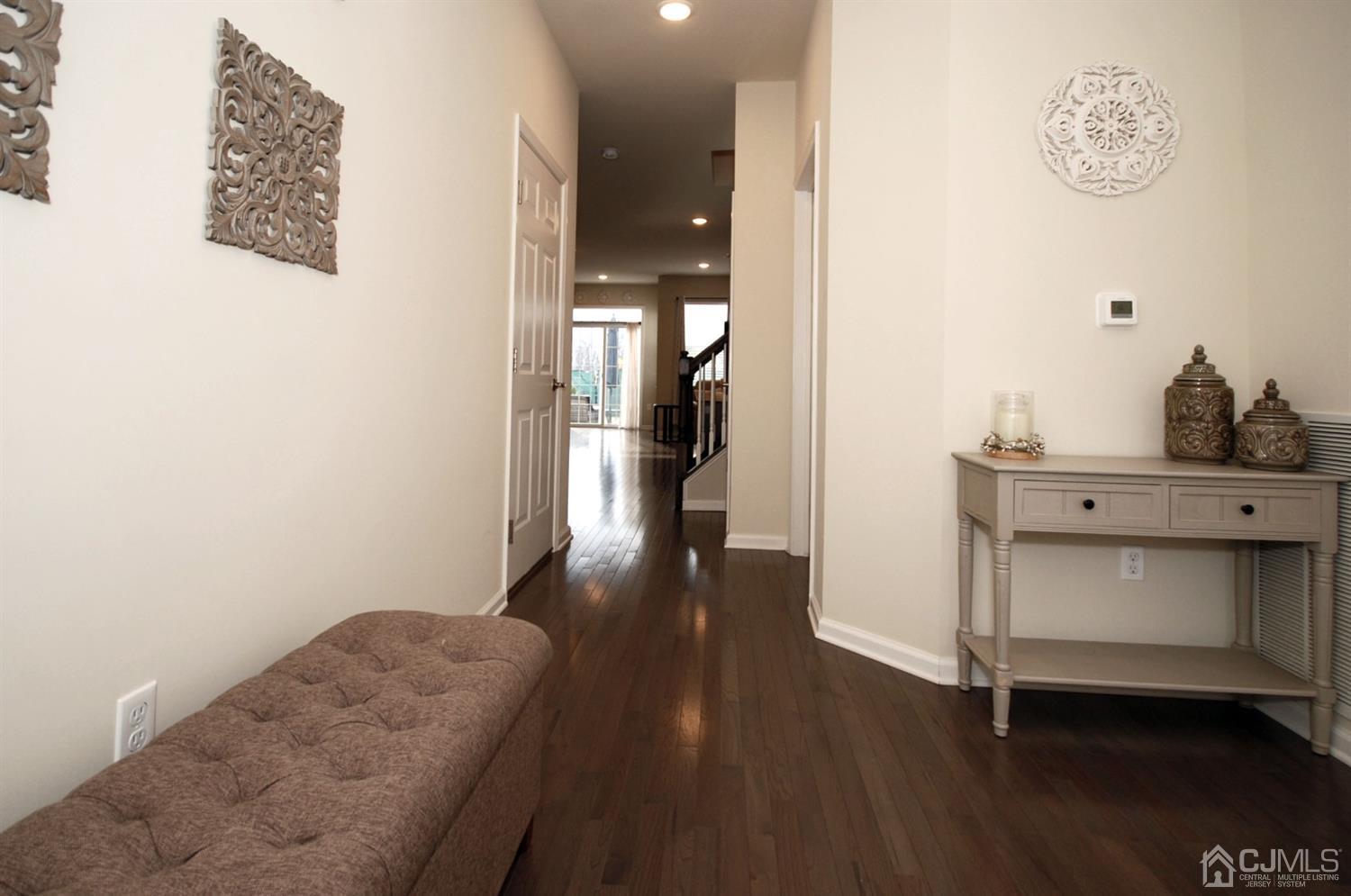 9 Flagger Lane Hamilton, NJ 08619 - Photo 3 of 24 a hallway with a wooden floor