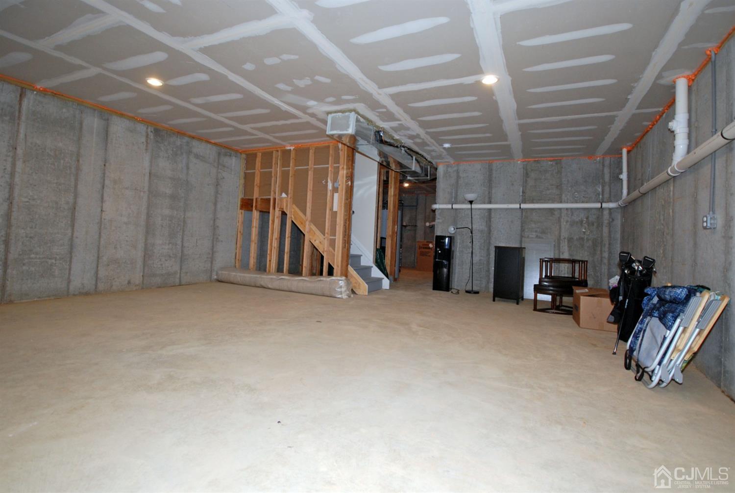 9 Flagger Lane Hamilton, NJ 08619 - Photo 22 of 24 a view of an empty room with gym equipment