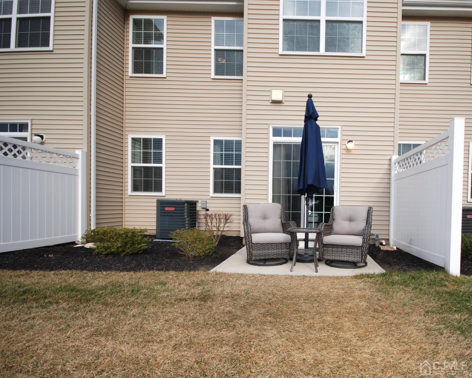 9 Flagger Lane Hamilton, NJ 08619 - Photo 24 of 24 a view of backyard with brick wall and potted plants
