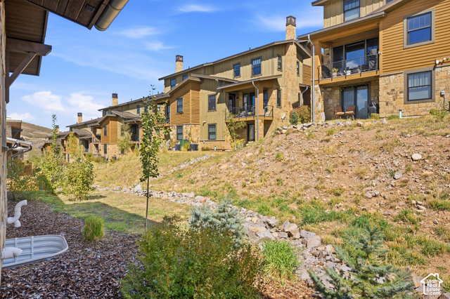 369 East Overlook Loop Kamas, UT 84036 - Photo 54 of 64 Terraced townhomes featuring stone and siding exteriors, private balconies, and ground-level patios