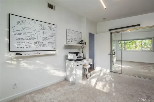 a view of kitchen with stainless steel appliances granite countertop a stove top oven a sink and a refrigerator