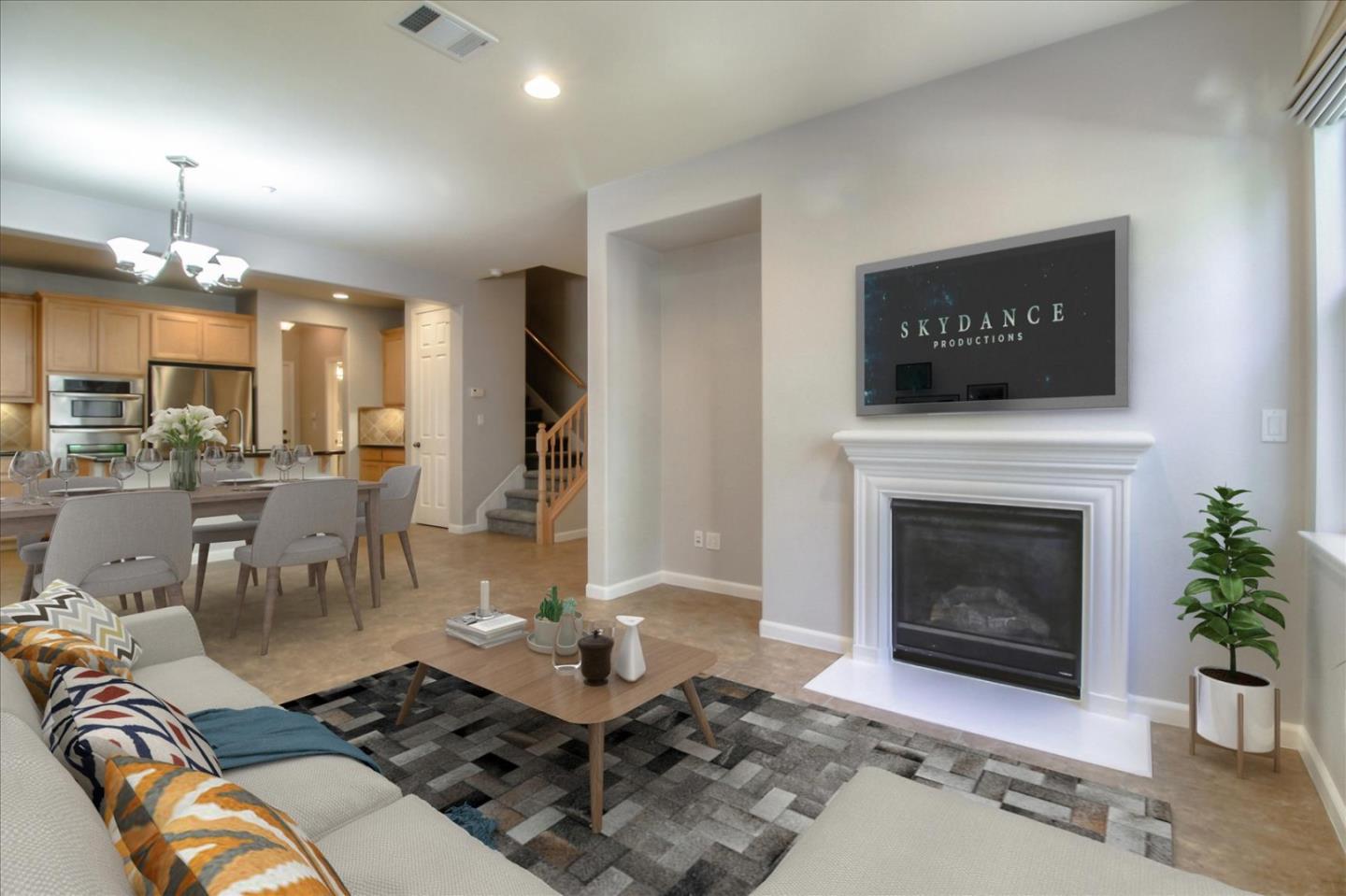 5306 Fioli Loop San Ramon, CA 94582 - Photo 3 of 14 a living room with furniture a fireplace and a flat screen tv