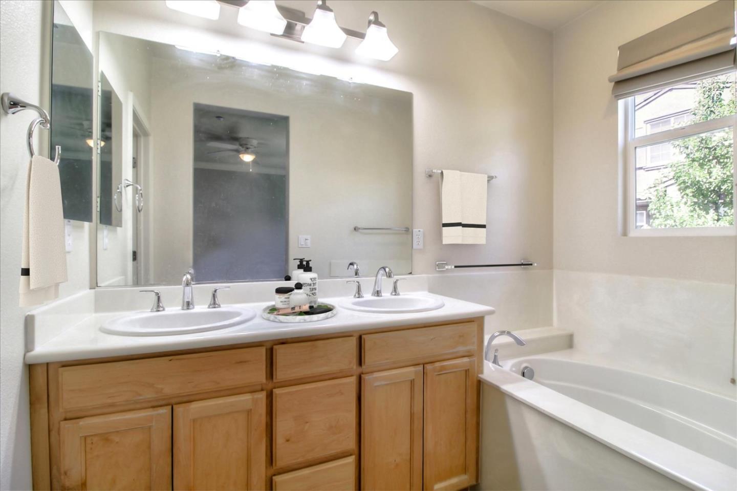 5306 Fioli Loop San Ramon, CA 94582 - Photo 6 of 14 a bathroom with a sink and a bathtub