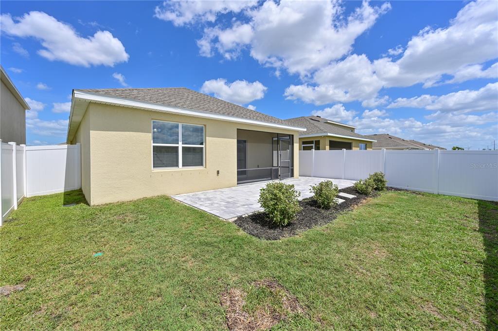 4919 Wedgeleaf Way Palmetto, FL 34221 - Photo 16 of 35 a front view of a house with garden
