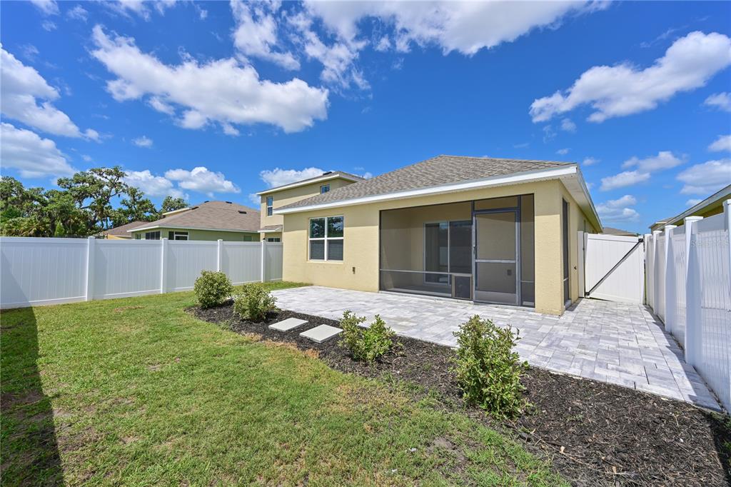 4919 Wedgeleaf Way Palmetto, FL 34221 - Photo 2 of 35 a front view of a house with garden