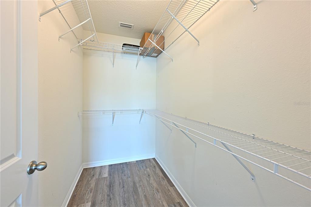 4919 Wedgeleaf Way Palmetto, FL 34221 - Photo 32 of 35 a view of a room with racks on the wall