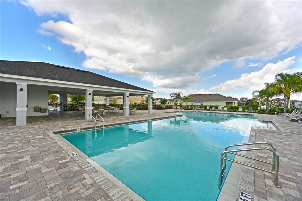 4919 Wedgeleaf Way Palmetto, FL 34221 - Photo 33 of 35 a view of a swimming pool with a patio