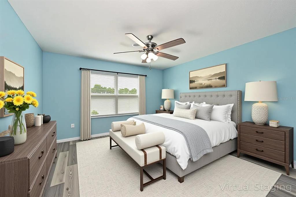 4919 Wedgeleaf Way Palmetto, FL 34221 - Photo 7 of 35 a bedroom with a bed dresser and a window