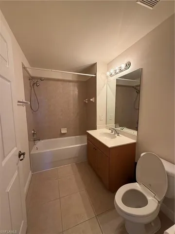 a bathroom with a sink a toilet and bathtub