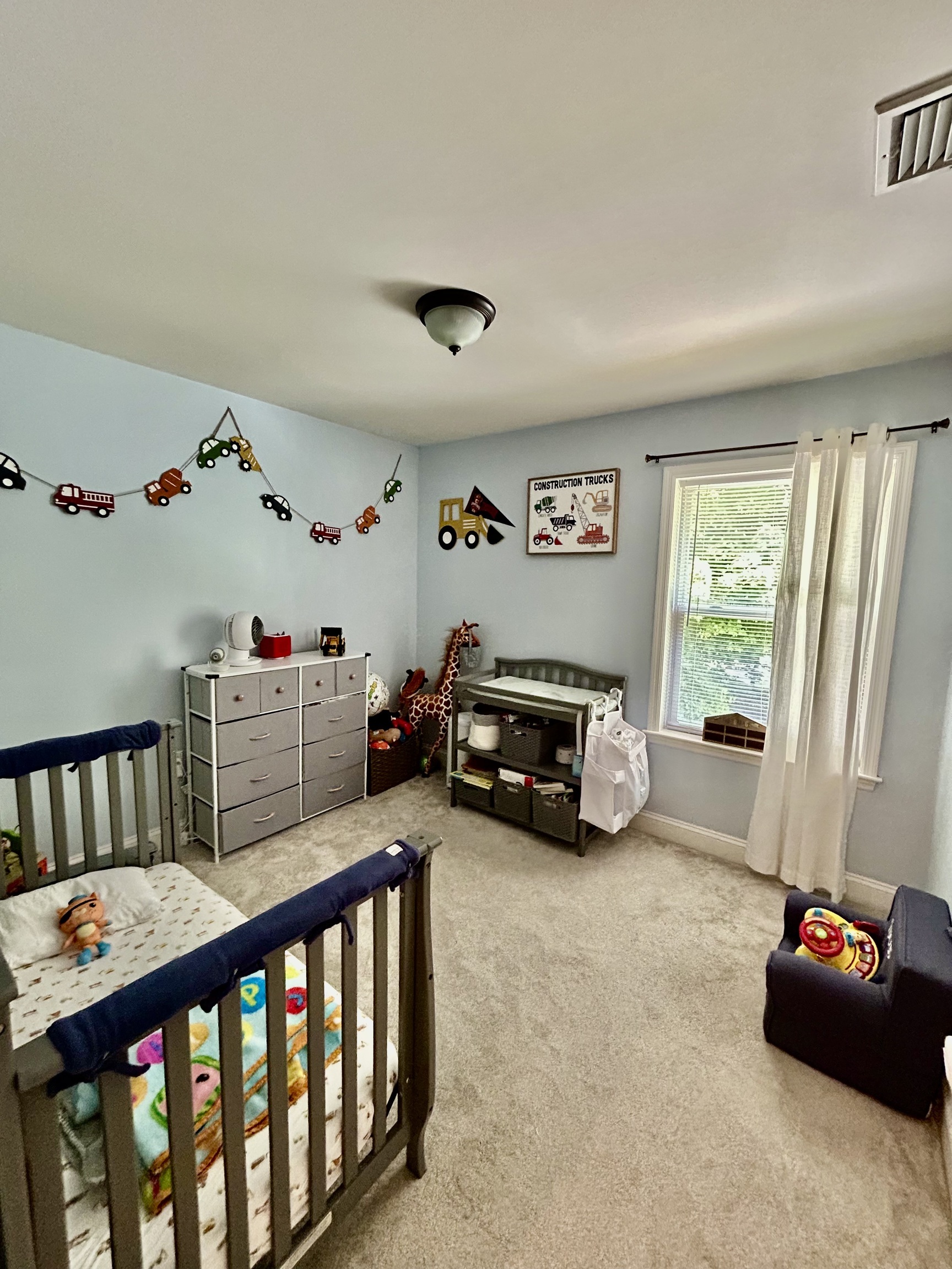 14 Linden Street, Unit C Norwalk, CT 06851 - Photo 11 of 16 a bedroom with furniture and a window