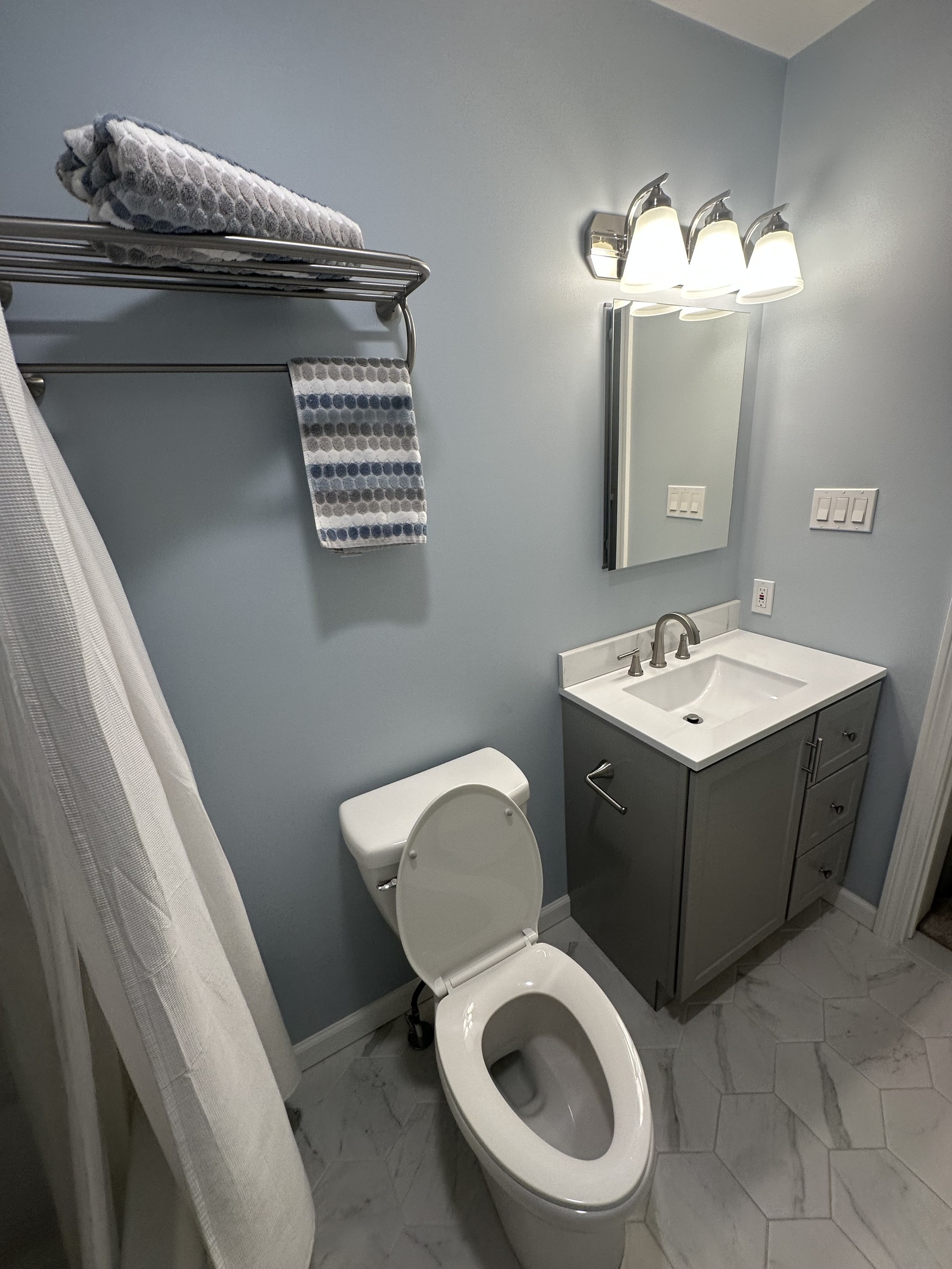 14 Linden Street, Unit C Norwalk, CT 06851 - Photo 14 of 16 a bathroom with a toilet sink and mirror