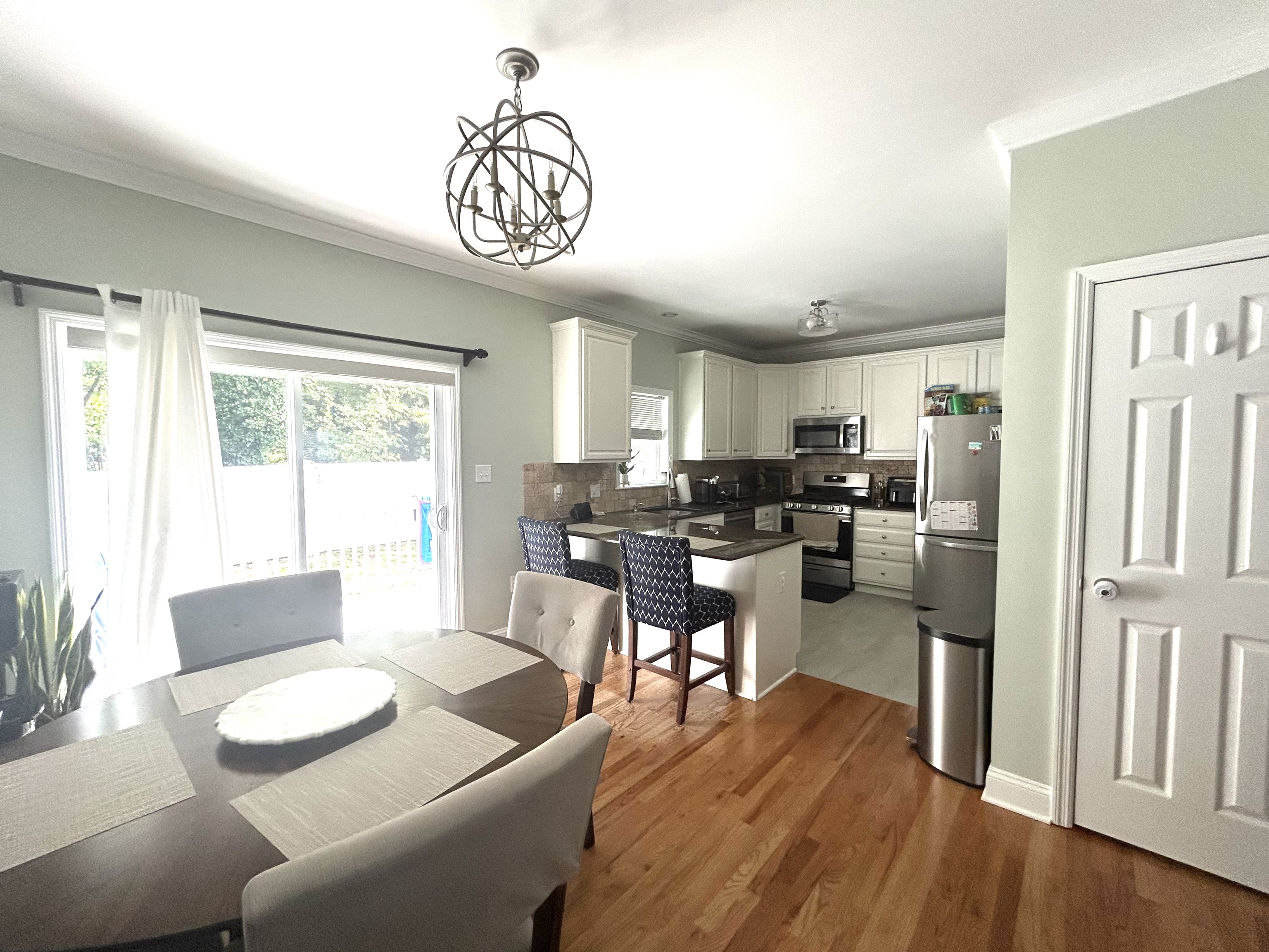 14 Linden Street, Unit C Norwalk, CT 06851 - Photo 4 of 16 a view of a dining room with furniture window and wooden floor