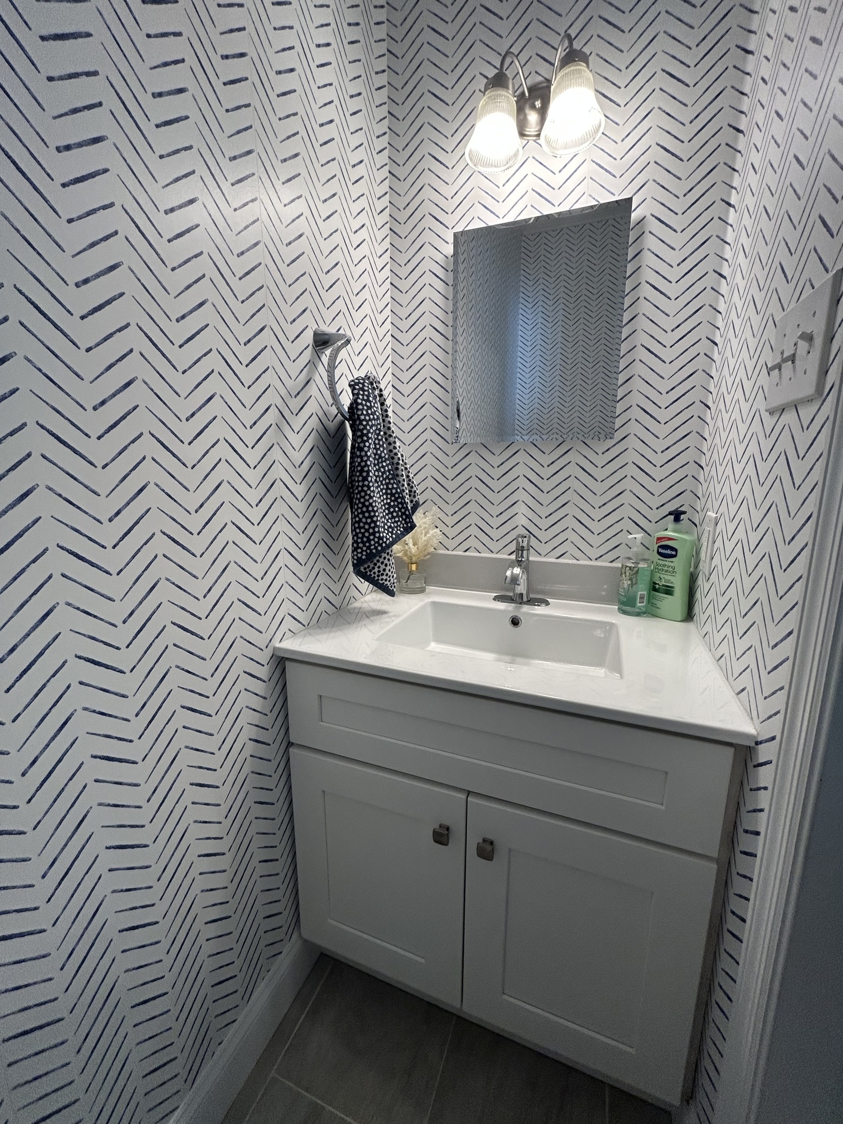 14 Linden Street, Unit C Norwalk, CT 06851 - Photo 7 of 16 a bathroom with a sink a mirror and vanity