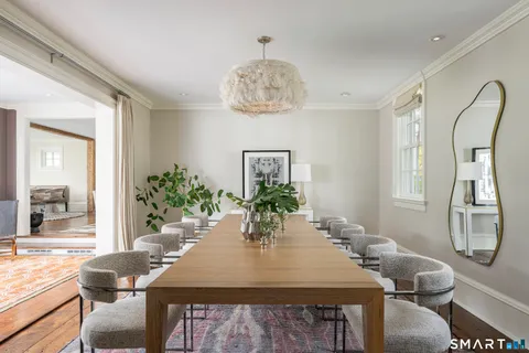 a view of a dining room with furniture and window