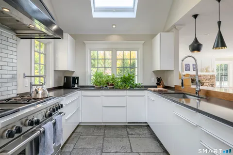 a kitchen with a sink stove and window