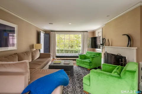 a living room with furniture rug and window