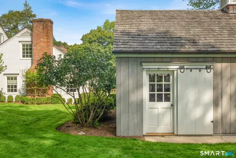 a view of front door of house with yard