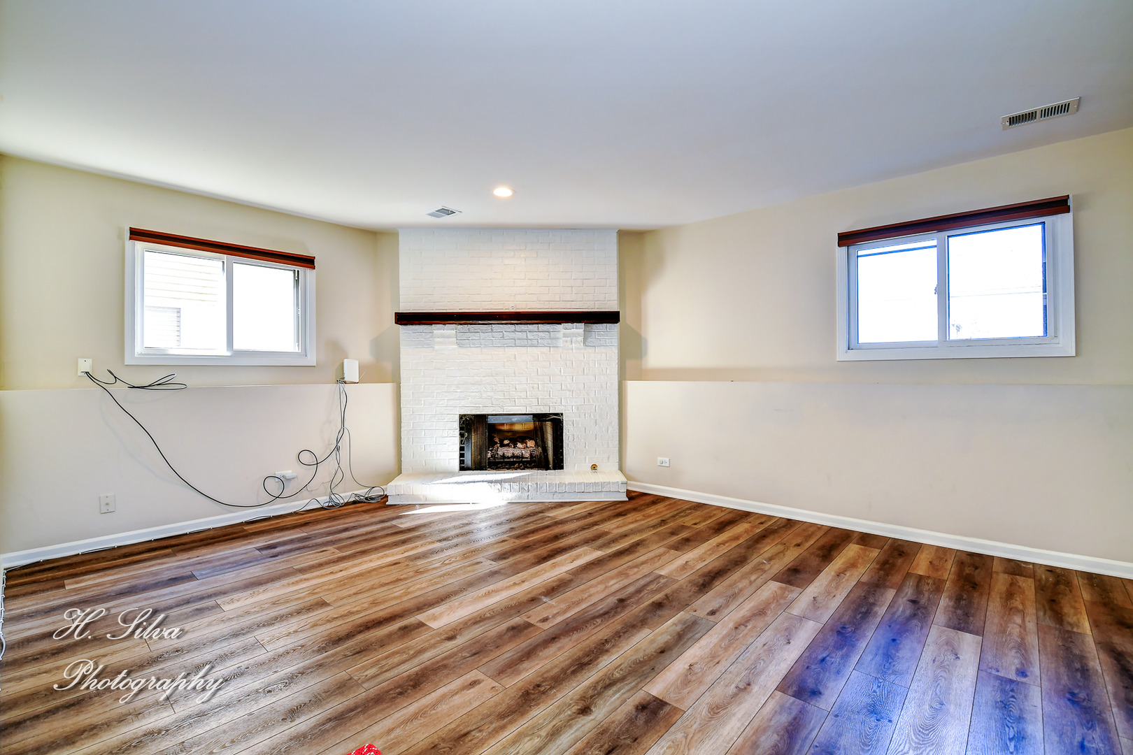 109 Deerpath Road Lake In The Hills, IL 60156 - Photo 11 of 22 a view of empty room with wooden floor and fireplace