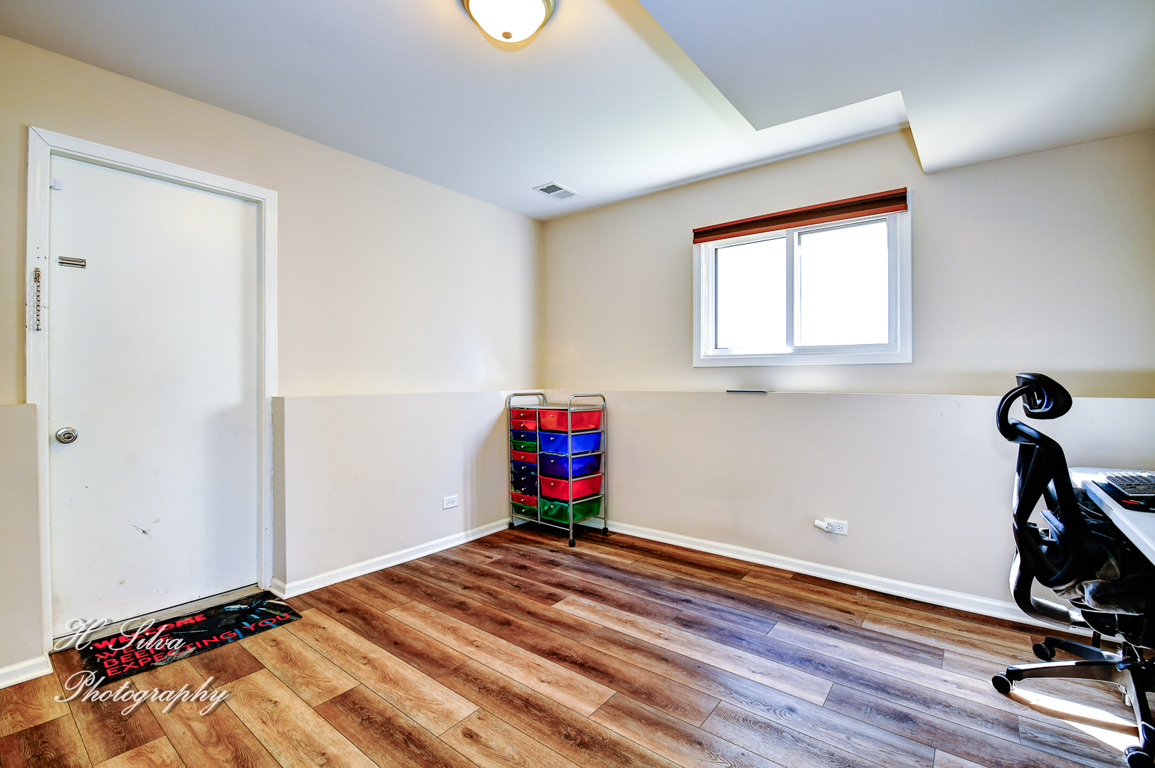 109 Deerpath Road Lake In The Hills, IL 60156 - Photo 13 of 22 a room with stairs and a wooden floor