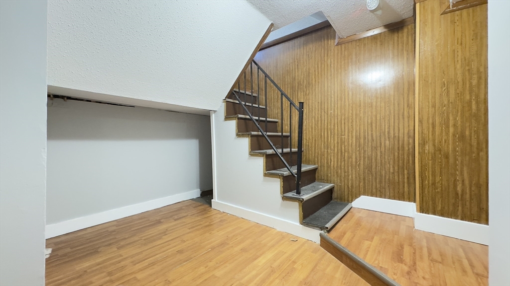 150 Pleasant Street, Unit 1 Lowell, MA 01852 - Photo 9 of 19 a view of entryway with wooden floor