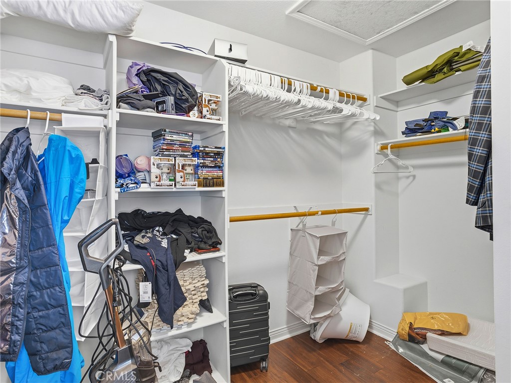 20316 Wynfreed Lane Porter Ranch, CA 91326 - Photo 22 of 51 a view of walk in closet with clothes and shoes
