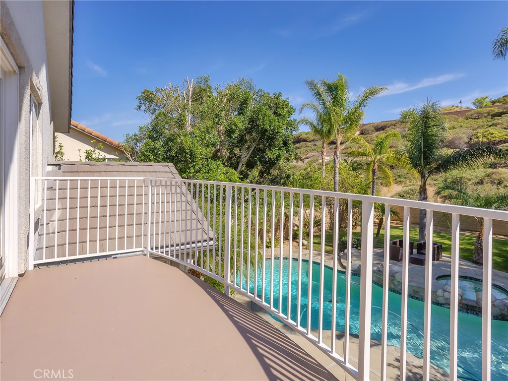 20316 Wynfreed Lane Porter Ranch, CA 91326 - Photo 23 of 51 a view of a balcony with a floor to ceiling window and palm tree
