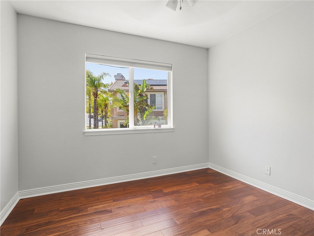 20316 Wynfreed Lane Porter Ranch, CA 91326 - Photo 25 of 51 an empty room with wooden floor and a window