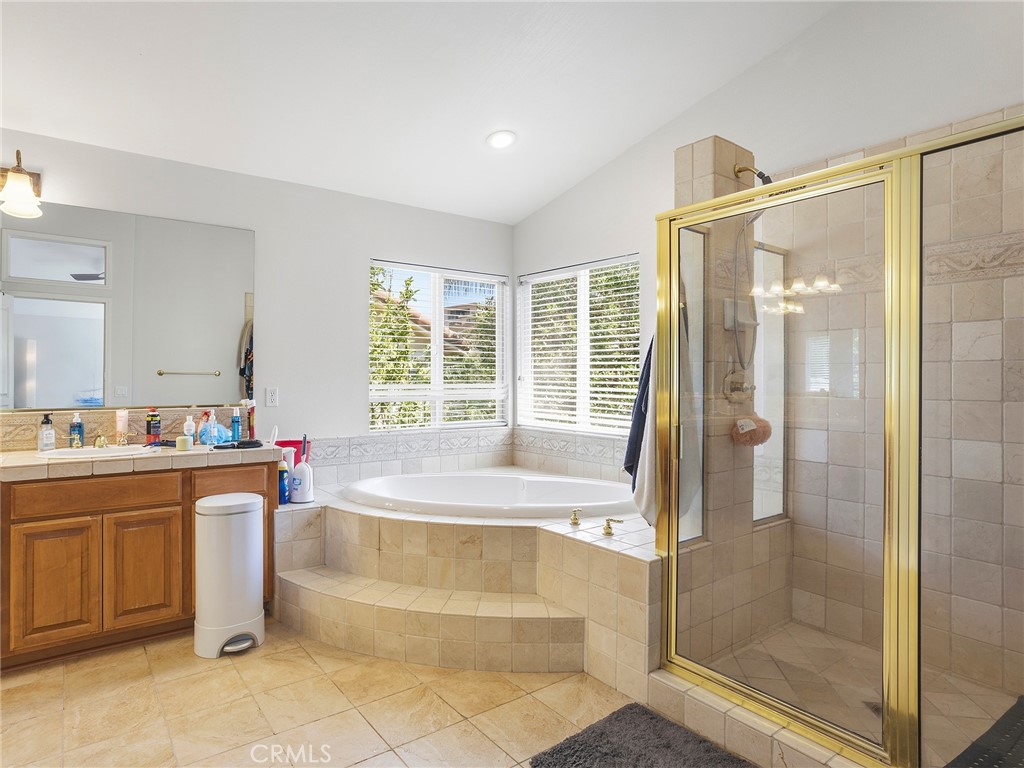 20316 Wynfreed Lane Porter Ranch, CA 91326 - Photo 28 of 51 a bathroom with a tub sink and mirror
