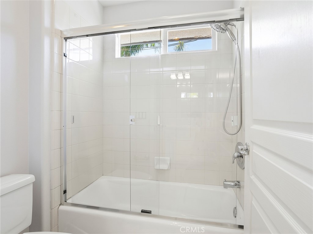 20316 Wynfreed Lane Porter Ranch, CA 91326 - Photo 31 of 51 a bathroom with a glass shower door