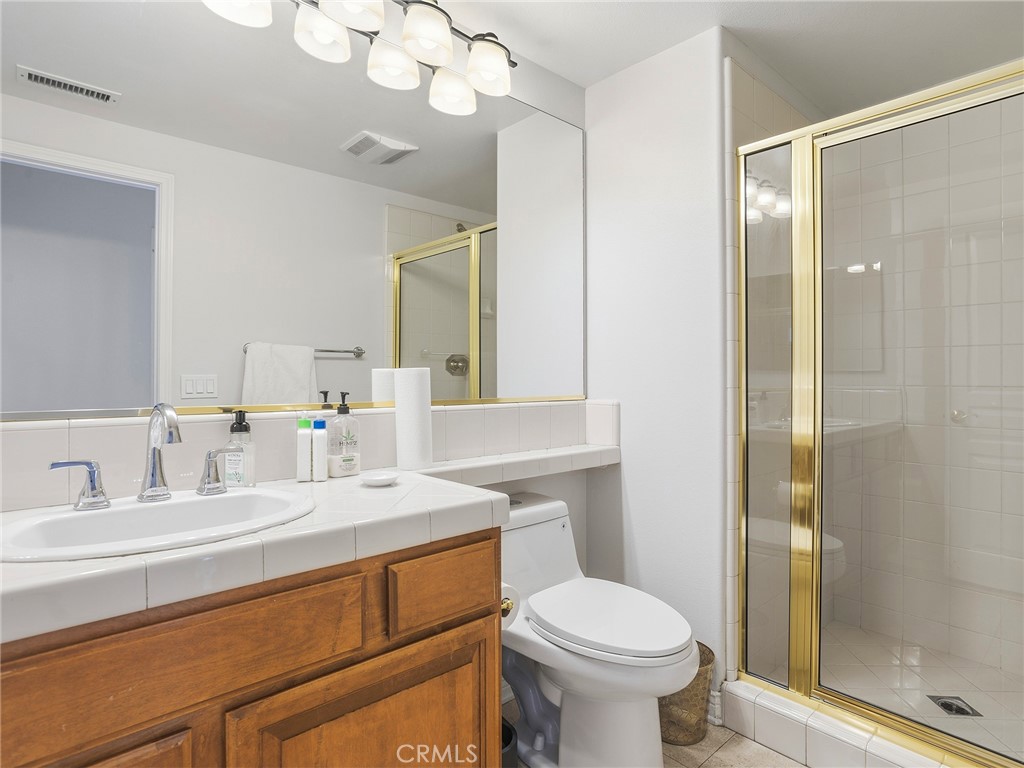 20316 Wynfreed Lane Porter Ranch, CA 91326 - Photo 32 of 51 a bathroom with a sink toilet and shower