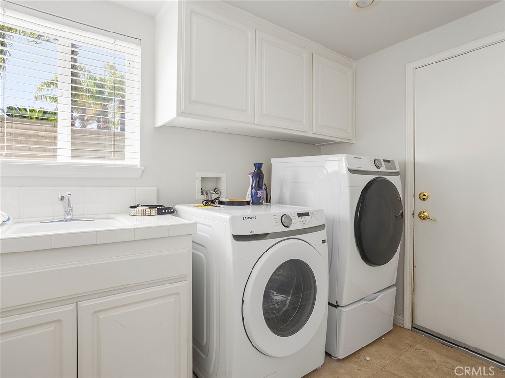 20316 Wynfreed Lane Porter Ranch, CA 91326 - Photo 33 of 51 a utility room with sink dryer and washer