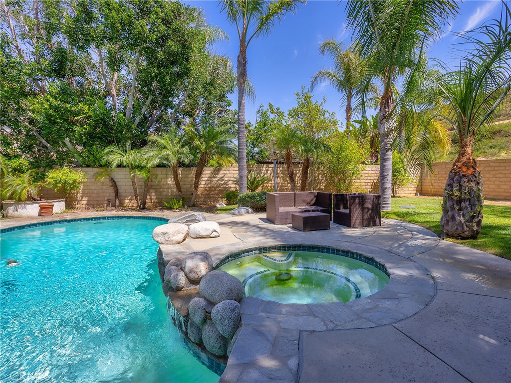 20316 Wynfreed Lane Porter Ranch, CA 91326 - Photo 36 of 51 a view of a swimming pool with a patio