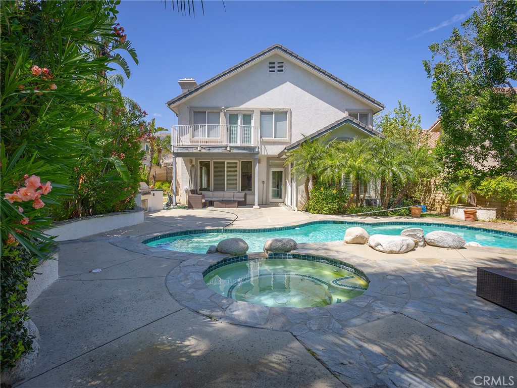 20316 Wynfreed Lane Porter Ranch, CA 91326 - Photo 38 of 51 a view of a house with swimming pool and a yard