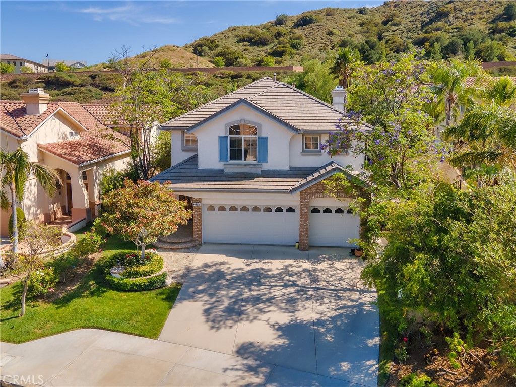 20316 Wynfreed Lane Porter Ranch, CA 91326 - Photo 44 of 51 a view of a house with a yard