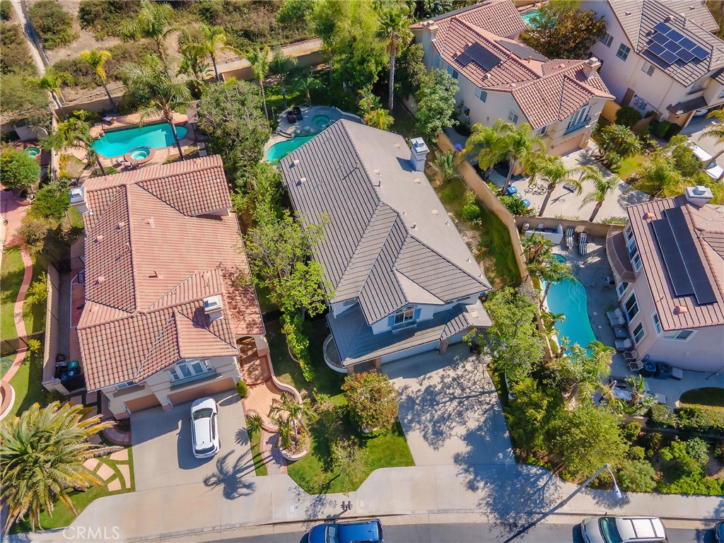 20316 Wynfreed Lane Porter Ranch, CA 91326 - Photo 45 of 51 an aerial view of a house with a yard and garden