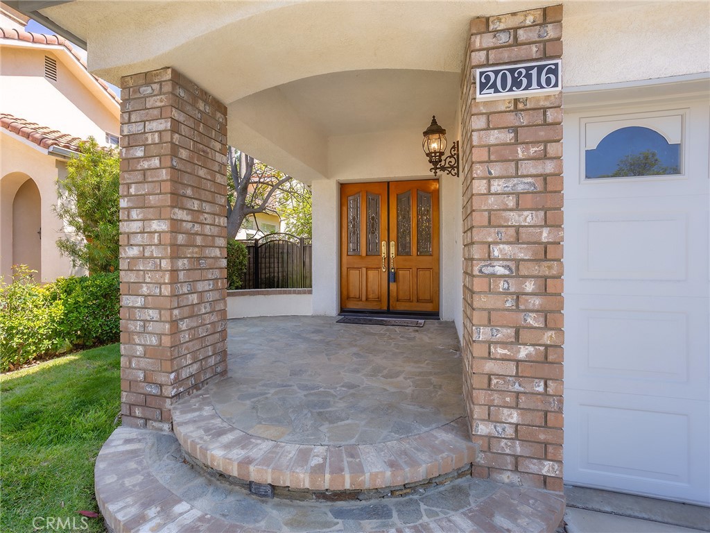 20316 Wynfreed Lane Porter Ranch, CA 91326 - Photo 6 of 51 a view of a entryway door