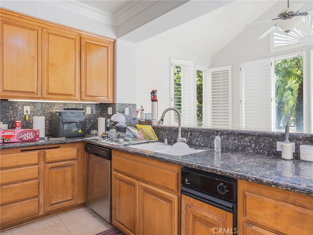 20316 Wynfreed Lane Porter Ranch, CA 91326 - Photo 9 of 51 a kitchen with sink cabinets and a large window