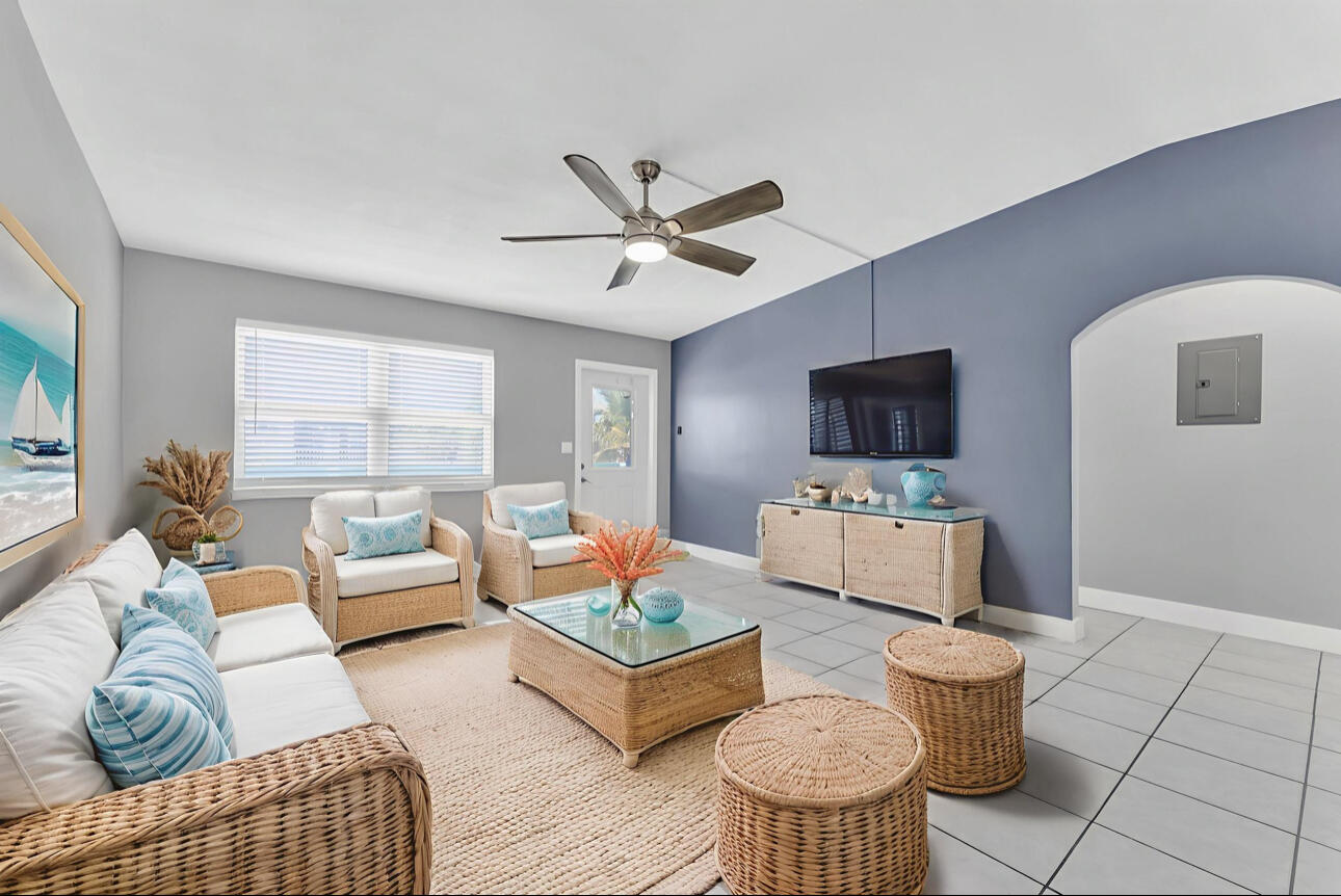 67 Coral Drive, Unit 1 Key Largo, FL 33037 - Photo 14 of 23 a living room with furniture and a flat screen tv