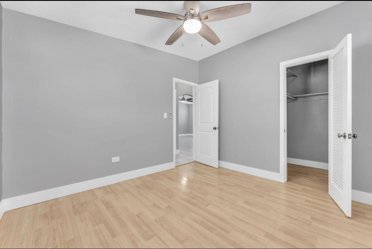 67 Coral Drive, Unit 1 Key Largo, FL 33037 - Photo 17 of 23 an empty room with closet and a ceiling fan